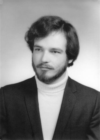Bruce Burroughs as a young man in turtle neck and suit coat